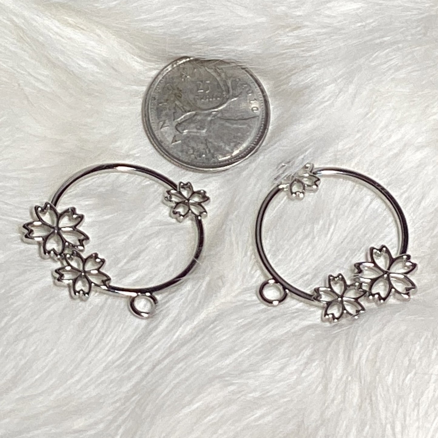 Silver plated circle with flowers